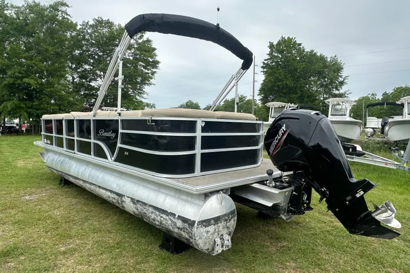 Slide: The Image of 2021 Bentley Pontoons 240 CRUISE on grass, featuring a Mercury outboard motor. - 3