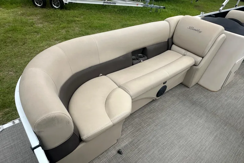 Slide: The Image of 2021 Bentley Pontoons 240 CRUISE interior with beige seating and cup holders. - 9