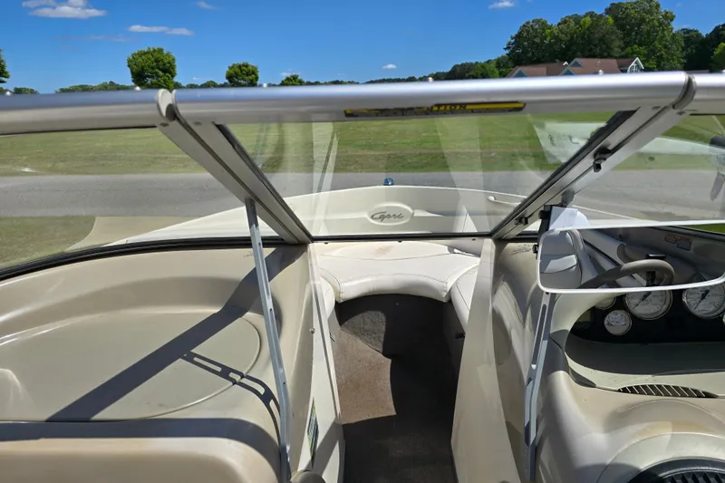Slide: The Image of 1999 Bayliner 1850 Capri SS boat interior with windshield and dashboard view. - 16