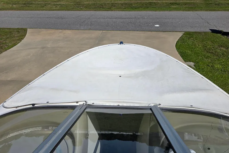 Slide: The Image of 1999 Bayliner 1850 Capri SS boat bow view on driveway. - 19
