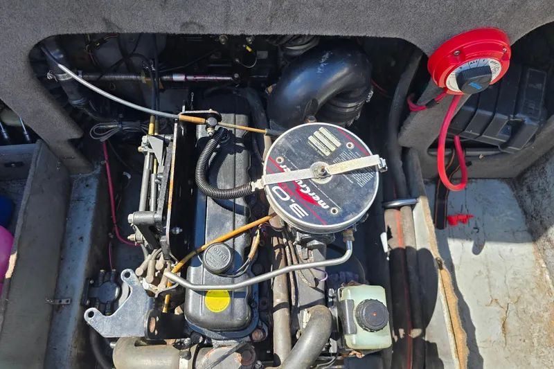 Slide: The Image of Engine compartment of a 1999 Bayliner 1850 Capri SS boat, featuring a MerCruiser engine. - 21