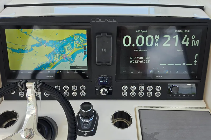 Slide: The Image of Dashboard of 2026 Solace 28HCS boat with Garmin navigation displays and controls. - 12