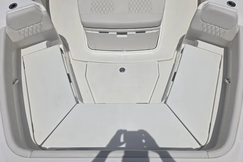 Slide: The Image of Interior view of 2026 Solace 28HCS boat, featuring spacious seating and storage compartments. - 16