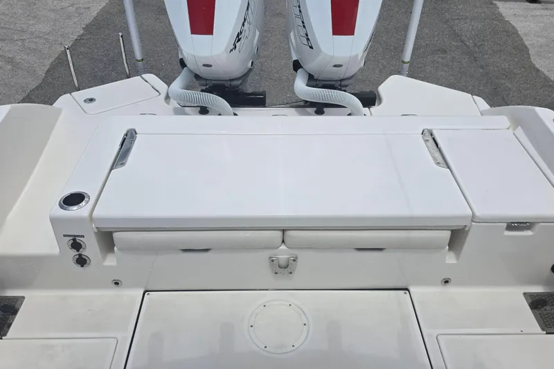 Slide: The Image of 2026 Solace 28HCS boat stern with dual outboard engines and spacious deck layout. - 17