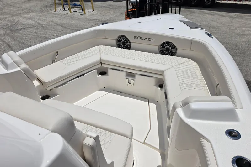 Slide: The Image of Luxurious seating area on a 2026 Solace 28HCS boat, featuring elegant white upholstery. - 19