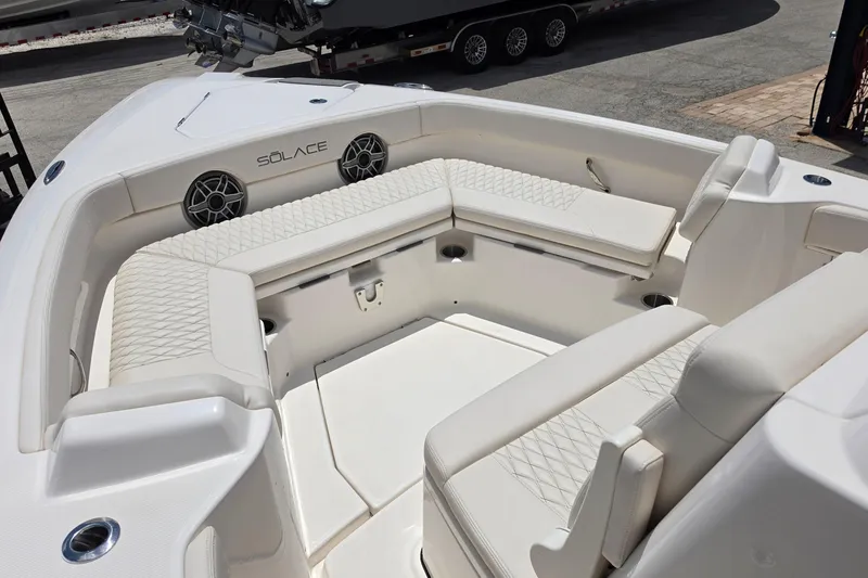 Slide: The Image of Luxurious seating area on the 2026 Solace 28HCS boat, featuring elegant white upholstery. - 20