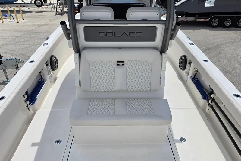 Slide: The Image of 2026 Solace 28HCS boat interior with cushioned seating and modern design. - 8