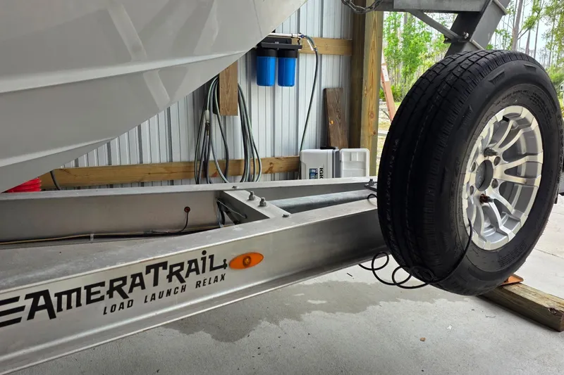 Slide: The Image of Trailer for 2018 SeaVee 270Z boat with AmeraTrail branding in a garage. - 11