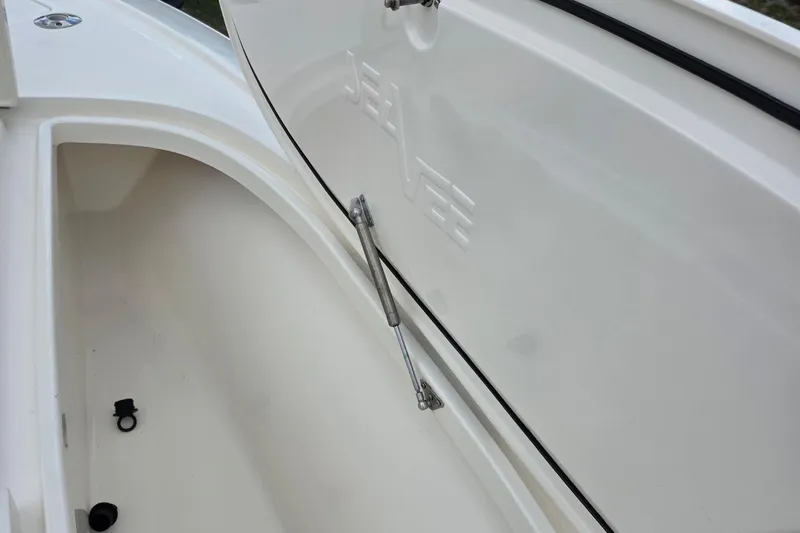 Slide: The Image of 2018 SeaVee 270Z boat storage compartment with open hatch and hydraulic support. - 7