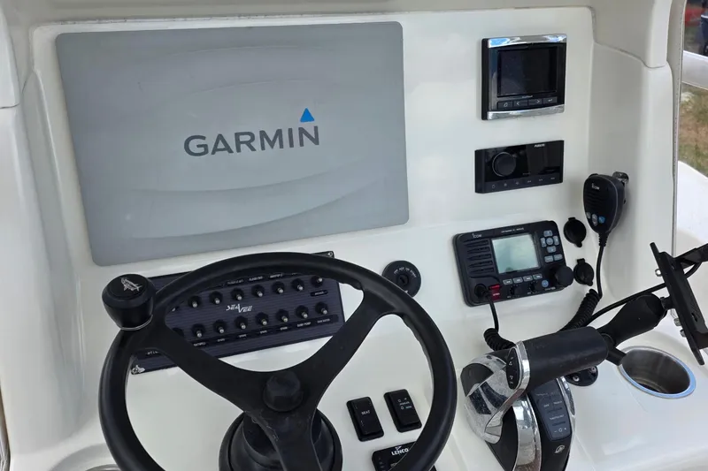 Slide: The Image of Console of a 2018 SeaVee 270Z boat featuring Garmin navigation equipment. - 9