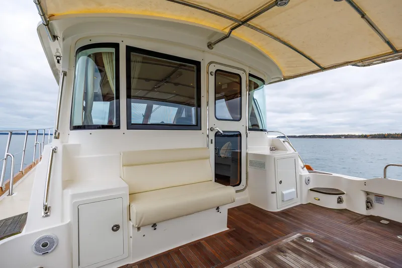 Slide: The Image of 2014 Grand Banks 46 Eastbay SX yacht deck with seating and ocean view. - 19