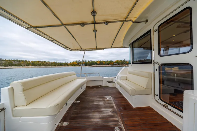 Slide: The Image of Luxurious 2014 Grand Banks 46 Eastbay SX yacht with spacious deck and scenic water view. - 21
