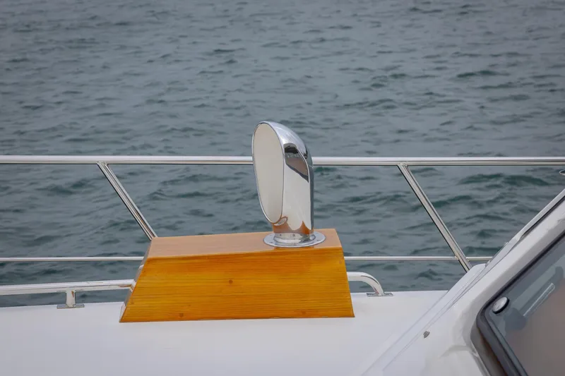 Slide: The Image of 2014 Grand Banks 46 Eastbay SX yacht detail with chrome vent and wooden base. - 23
