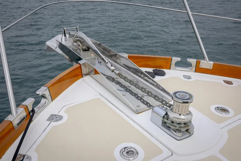 Slide: The Image of Bow of 2014 Grand Banks 46 Eastbay SX yacht with anchor chain and winch. - 24