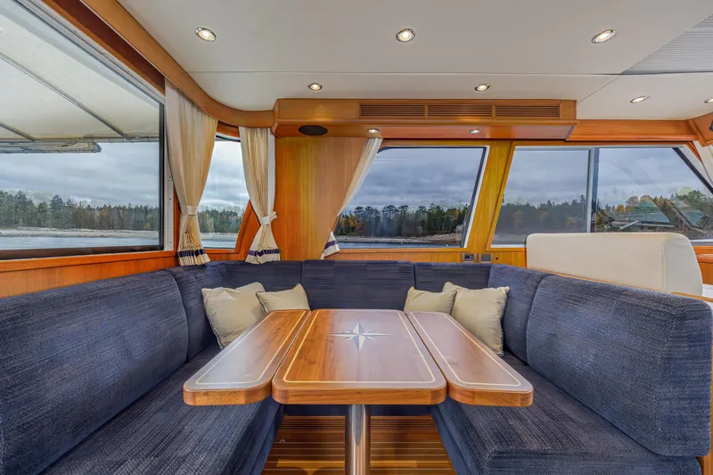 Slide: The Image of Luxurious interior of 2014 Grand Banks 46 Eastbay SX yacht with elegant seating and scenic views. - 29