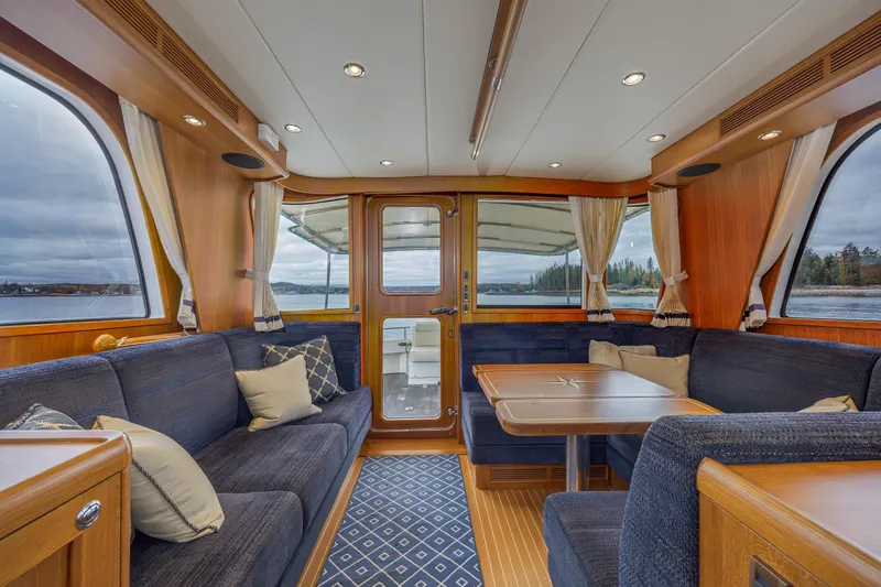 Slide: The Image of Luxurious interior of 2014 Grand Banks 46 Eastbay SX yacht with elegant seating and wooden finishes. - 31