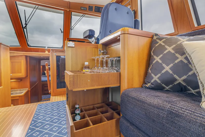 Slide: The Image of Luxurious interior of 2014 Grand Banks 46 Eastbay SX yacht with elegant wood finish. - 33