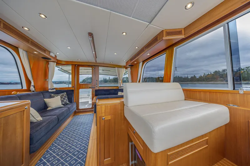 Slide: The Image of Luxurious interior of 2014 Grand Banks 46 Eastbay SX yacht with elegant wood finish. - 35