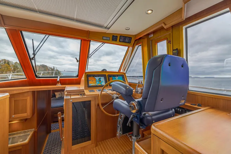 Slide: The Image of Interior helm of 2014 Grand Banks 46 Eastbay SX yacht with navigation equipment. - 38