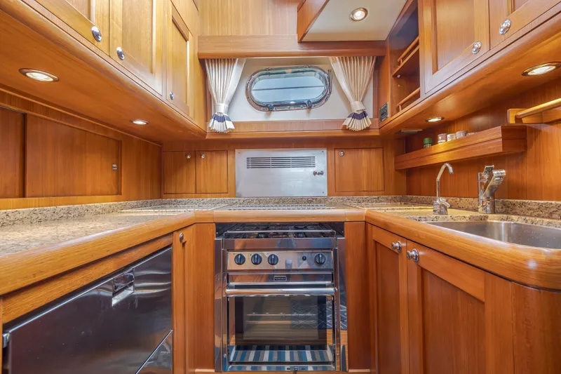 Slide: The Image of Luxurious wooden kitchen interior of 2014 Grand Banks 46 Eastbay SX yacht. - 45