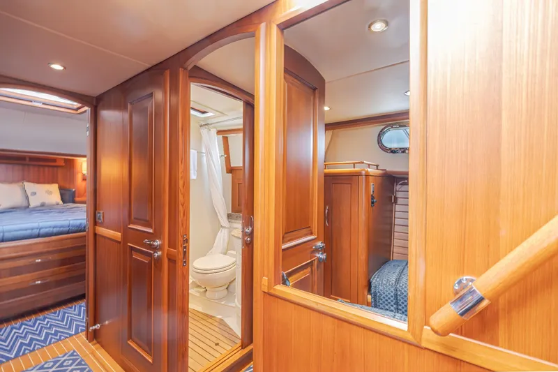 Slide: The Image of Luxurious 2014 Grand Banks 46 Eastbay SX yacht interior with wood finish and cozy cabin. - 49