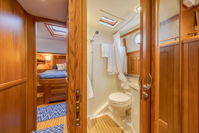 Slide: The Image of Luxurious 2014 Grand Banks 46 Eastbay SX yacht interior with cozy cabin and elegant bathroom. - 50