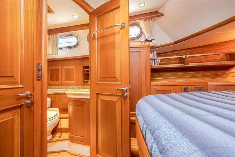 Slide: The Image of Luxurious wooden interior of 2014 Grand Banks 46 Eastbay SX yacht cabin and bathroom. - 57