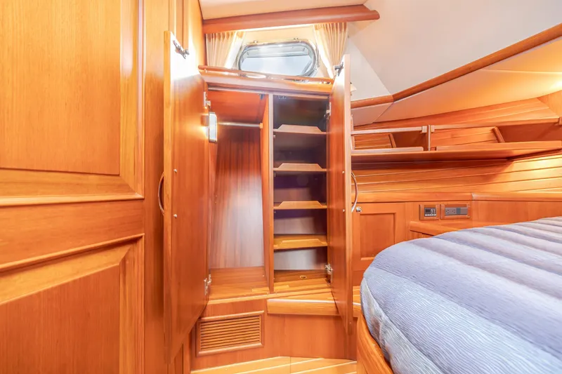 Slide: The Image of Luxurious wooden interior of 2014 Grand Banks 46 Eastbay SX yacht cabin. - 58