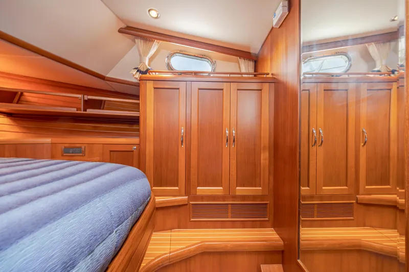 Slide: The Image of Luxurious wooden interior of 2014 Grand Banks 46 Eastbay SX yacht cabin. - 60