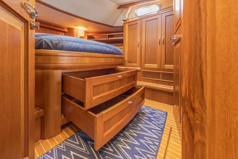 Slide: The Image of Luxurious wooden interior of 2014 Grand Banks 46 Eastbay SX yacht cabin. - 61