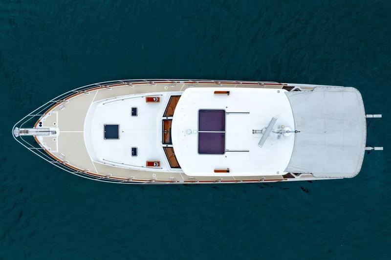 Slide: The Image of Overhead view of 2014 Grand Banks 46 Eastbay SX yacht on blue water. - 8