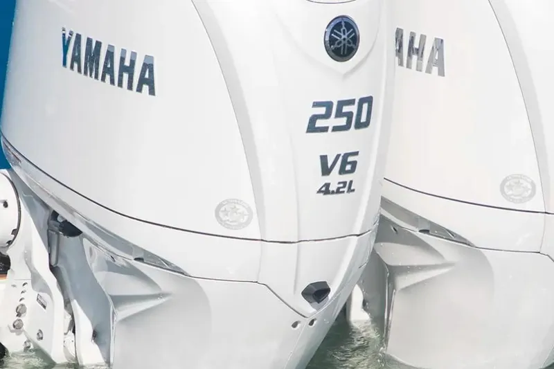 Slide: The Image of Two Yamaha 250 V6 4.2L outboard engines on a boat in the water. - 2