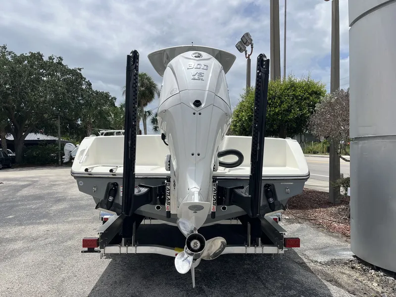 Slide: The Image of Rear view of a 2026 Pathfinder 2400 Open boat with outboard motor. - 5