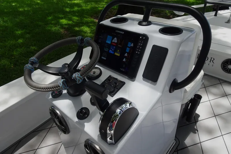 Slide: The Image of 2024 Xplor X18 Delta D18 boat console with steering wheel and navigation display. - 14