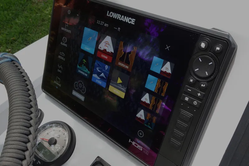 Slide: The Image of Lowrance marine display on Xplor X18 Delta D18, 2024 model, showing navigation and sonar options. - 15