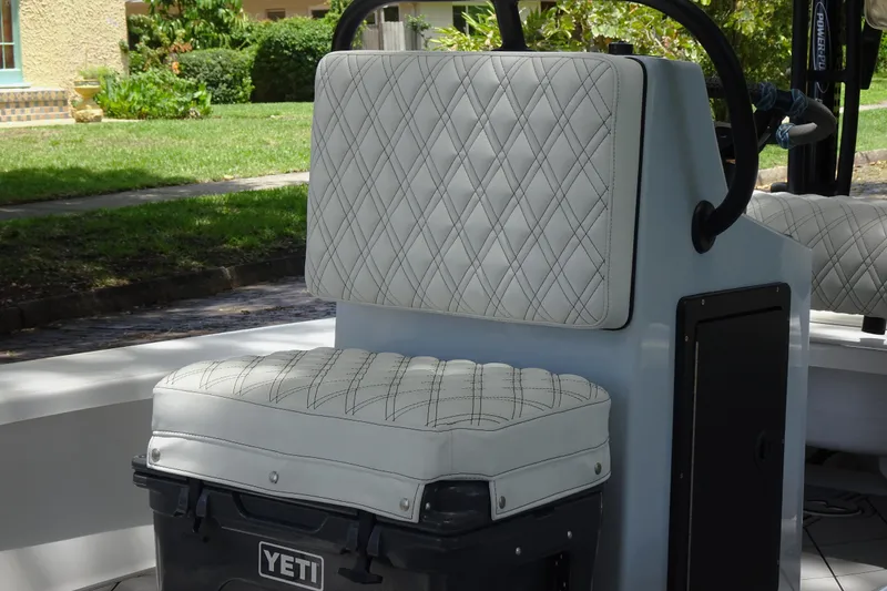 Slide: The Image of 2024 Xplor X18 Delta D18 boat seat with diamond-stitched upholstery and Yeti cooler. - 16