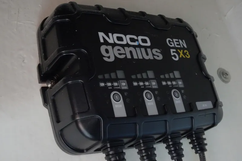 Slide: The Image of NOCO Genius GEN 5X3 battery charger mounted on wall, 2024 Xplor X18 Delta D18. - 22