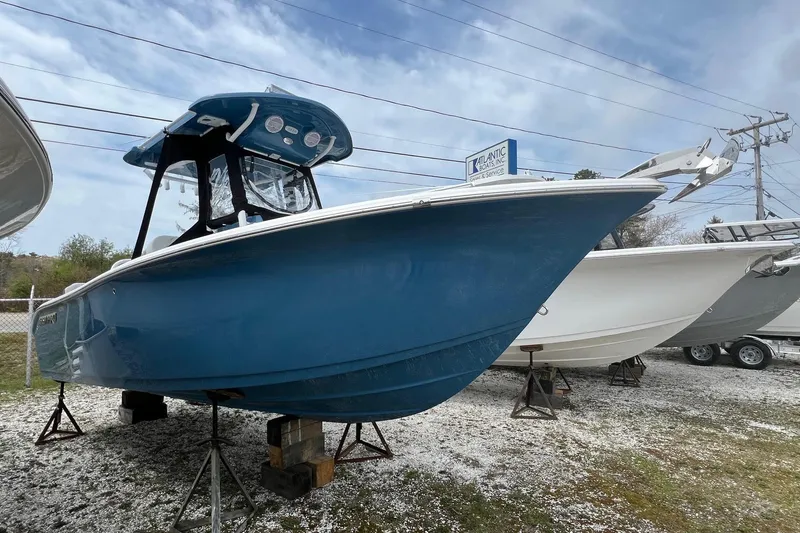 The Image of 2026 Sea Pro 225FLX Sandbar boat displayed outdoors on stands. - 0