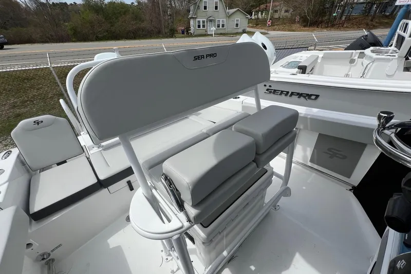 Slide: The Image of 2026 Sea Pro 225FLX Sandbar boat interior with seating and helm details. - 14