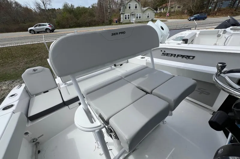 Slide: The Image of 2026 Sea Pro 225FLX Sandbar boat interior with seating and steering wheel. - 15