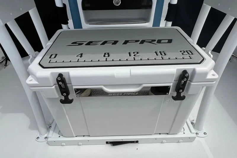 Slide: The Image of Sea Pro 225FLX Sandbar 2026 boat cooler with measuring scale on lid. - 17