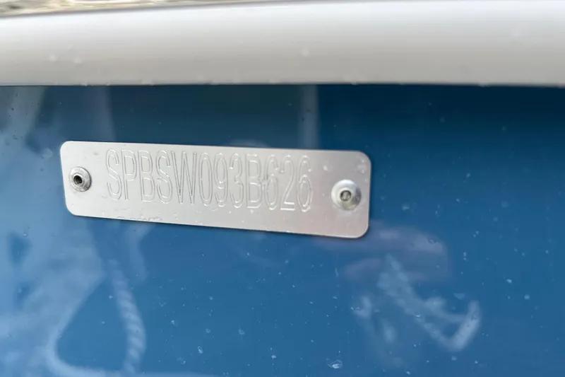 Slide: The Image of 2026 Sea Pro 225FLX Sandbar boat identification plate on blue hull. - 20