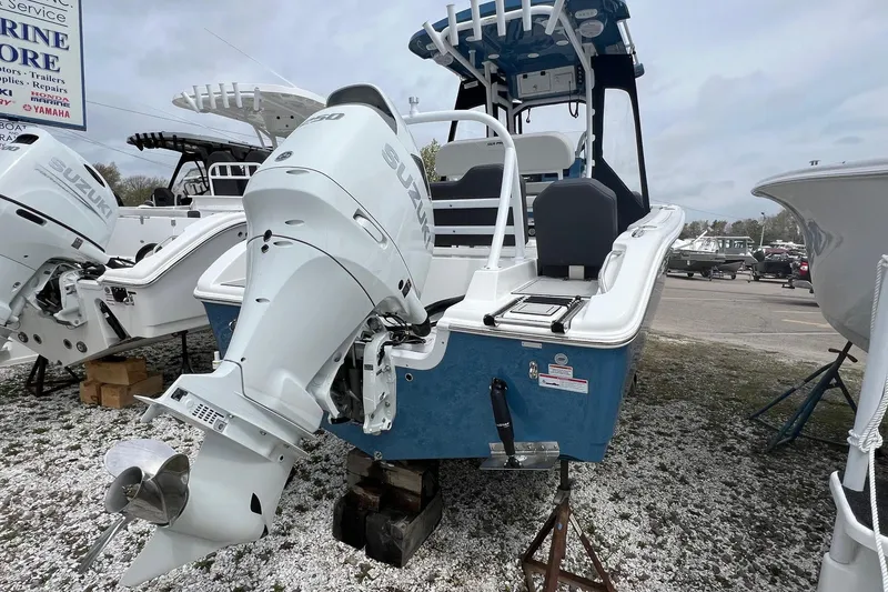 Slide: The Image of 2026 Sea Pro 225FLX Sandbar boat with Suzuki outboard motor displayed outdoors. - 22