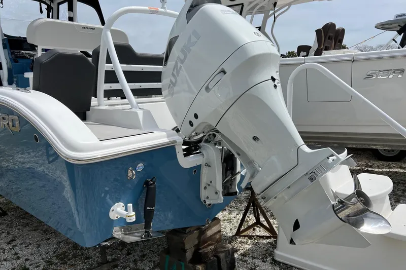 Slide: The Image of 2026 Sea Pro 225FLX Sandbar boat with Suzuki outboard motor, displayed outdoors. - 25