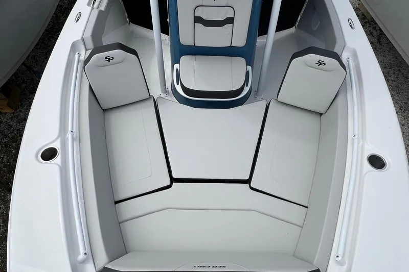 Slide: The Image of 2026 Sea Pro 225FLX Sandbar boat interior with cushioned seating and sleek design. - 4