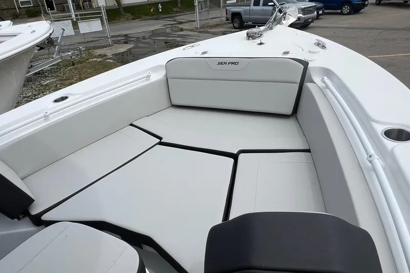 Slide: The Image of 2026 Sea Pro 225FLX Sandbar boat interior with cushioned seating and sleek design. - 5