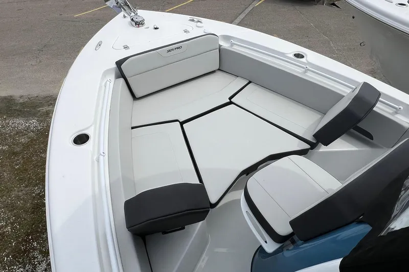 Slide: The Image of 2026 Sea Pro 225FLX Sandbar boat interior with cushioned seating and sleek design. - 8