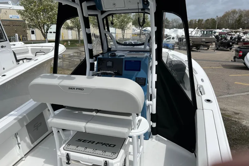 Slide: The Image of 2026 Sea Pro 225FLX Sandbar boat interior with helm and seating. - 9