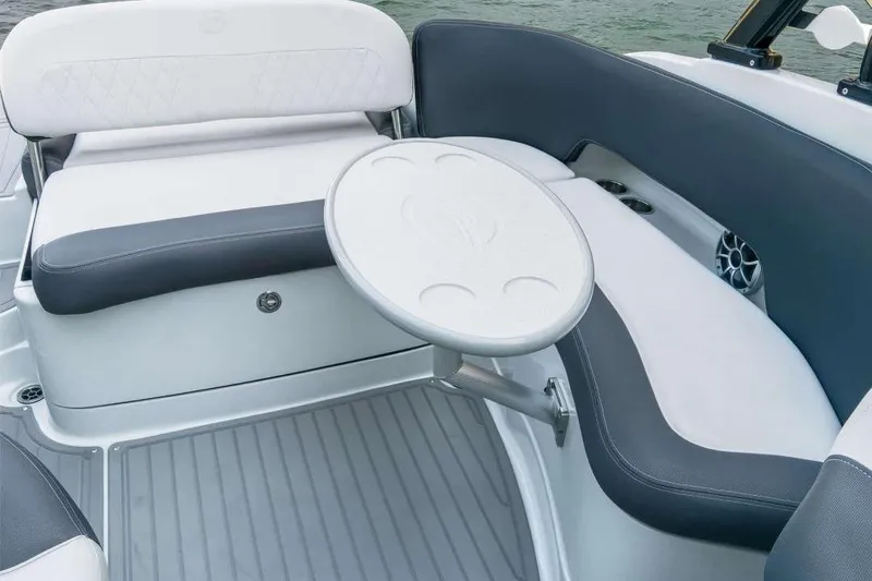 Slide: The Image of 2019 Crownline 255 SS SURF boat interior with seating and table. - 2