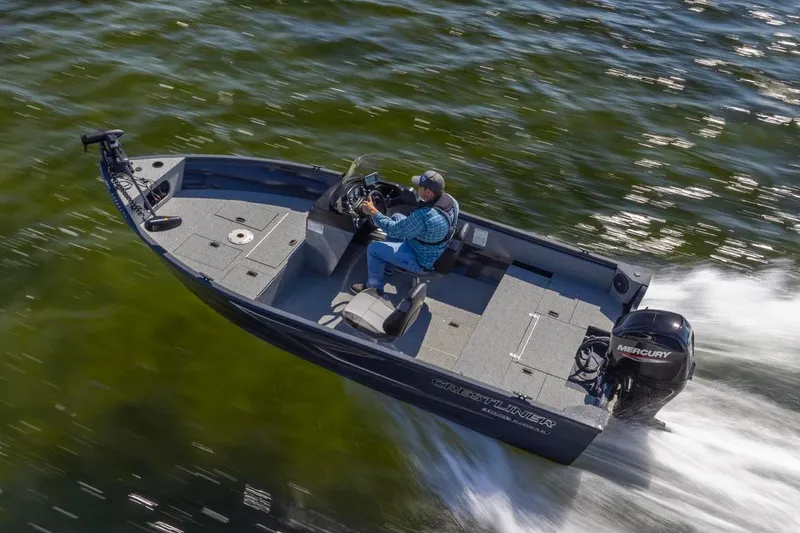 Slide: The Image of Manufacturer Provided Image: 2026 Crestliner 1650 Kodiak SC boat speeding on water, featuring Mercury engine. - 11